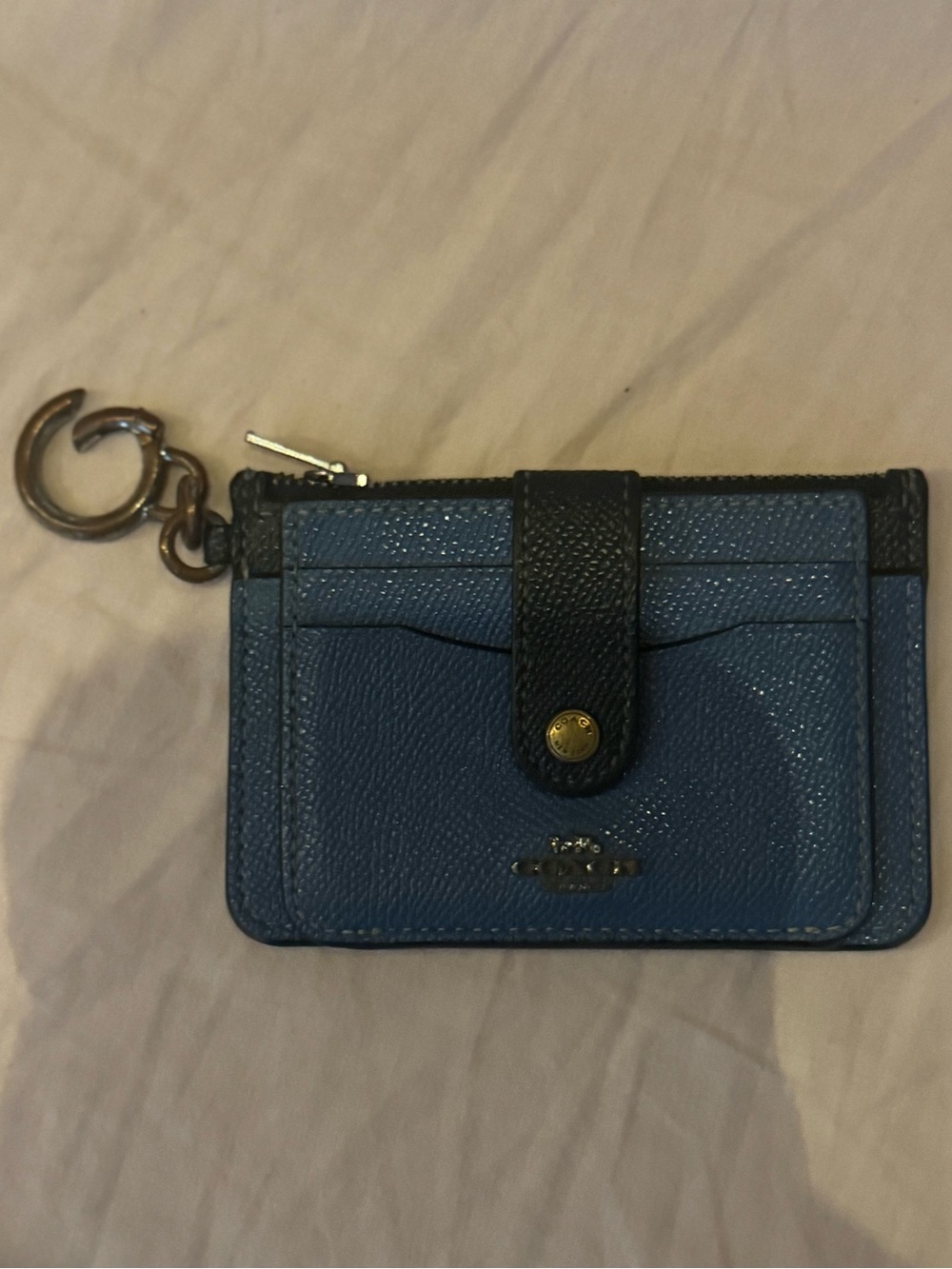 Coach mini wallet.
